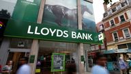 People walk past a branch of Lloyds Bank on Oxford Street in London, Britain July 28, 2016. REUTERS/Peter Nicholls/File Photo GLOBAL BUSINESS WEEK AHEAD PACKAGE - SEARCH 'BUSINESS WEEK AHEAD 24 OCT' FOR ALL IMAGES