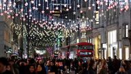 Bus passengers and shoppers view a Christmas light display along Oxford Street, London, Britain, November 20, 2021. REUTERS/Toby Melville
