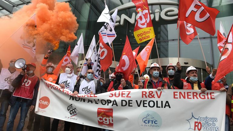 Unions members of Suez demonstrate against against Veolia's takeover bid on September 29, 2020 in La Defense, west of Paris, outside French energy firm Engie, parent company of Suez.