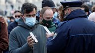 A visitor has his Green Pass checked at the entrance to the Roman Forum on the day before health passes become mandatory on public transport, in Rome, Italy December 5, 2021. REUTERS/Remo Casilli