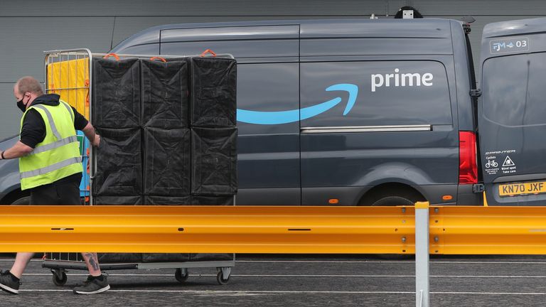 Electric delivery vans are packed at the Amazon warehouse in the Titanic Quarter, Belfast. Picture date: Wednesday April 21, 2021.