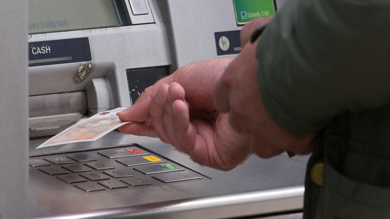 File photo dated 14/09/17 of a man withdrawing money from an ATM