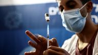 A nurse prepares a syringe to give a third dose of the COVID-19 vaccine, in Jerusalem
