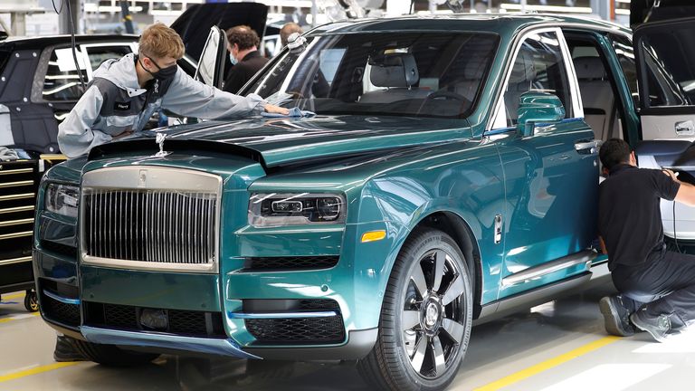 Technicians inspect a Rolls-Royce a car on the production line of the Rolls-Royce Goodwood factory, near Chichester, Britain, September 1, 2020