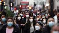 Shoppers walk along Oxford Street in central London