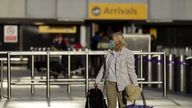 A passenger arrives at London Heathrow Airport's T3