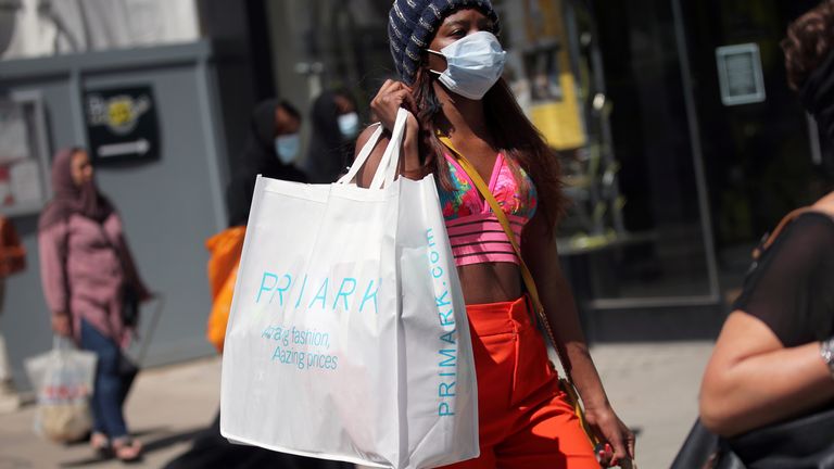 Outbreak of the coronavirus disease (COVID-19) in London
A woman walks with a bag of Primark store at Oxford Street, amid the spread of the coronavirus disease (COVID-19) in London, Britain June 15, 2020. REUTERS/Hannah McKay