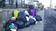 Overflowing bins awaiting collection by refuse workers on Cherry Street in the Walton area of Liverpool. Covid-related staff shortages across England are causing "terrible" rubbish collection delays with bins in some areas left "overflowing" with waste from the festive period. Picture date: Tuesday January 4, 2022.