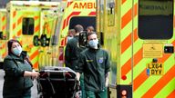 FILE PHOTO: Health workers move equipment between ambulances outside of the Royal London Hospital, amid the coronavirus disease (COVID-19) pandemic in London, Britain, January 7, 2022. REUTERS/Toby Melville/File Photo
