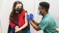 PABest Associate Practitioner Alex Iheanacho (right) administers a booster coronavirus vaccine to Shona McCauley (left) at a Covid vaccination centre at Elland Road in Leeds, as the booster vaccination programme continues across the UK. Picture date: Tuesday December 21, 2021.

