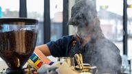  A barista makes coffee for a customer in Houston, Texas, U.S., March 10, 2021