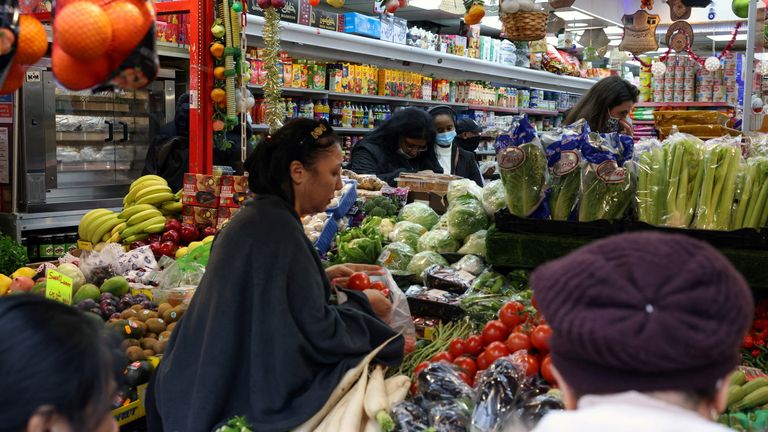 People shop at a supermarket amid the coronavirus disease (COVID-19) outbreak, in London, Britain December 24, 2021. REUTERS/Kevin Coombs
