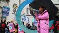 Mikaela Loach addresses protesters outside the Royal Courts of Justice