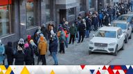 People stand in line to use an ATM money machine in Saint Petersburg, Russia February 27, 2022. REUTERS/Anton Vaganov