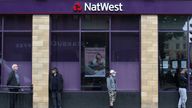 FILE PHOTO: People maintain social distance while they queue outside a Natwest bank in Wimbledon, following the outbreak of the coronavirus disease (COVID-19), London, Britain, May 1, 2020. REUTERS/Hannah McKay/File Photo
