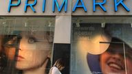 A woman walks past a window display showing new environmentally themed posters at a Primark store in Liverpool
A woman walks past a window display showing new environmentally themed posters at a Primark store in Liverpool, Britain, September 15, 2021. REUTERS/Phil Noble