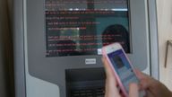 FILE PHOTO: A message demanding money is seen on a monitor of a payment terminal at a branch of Ukraine's state-owned bank Oschadbank after Ukrainian institutions were hit by a wave of cyber attacks earlier in the day, in Kyiv