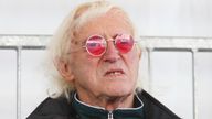 Jimmy Savile watches as Britain's Queen Elizabeth II names Cunard's newest cruise ship, the Queen Elizabeth in Southampton.
Read less
Picture by: Chris Ison/PA Archive/PA Images
Date taken: 11-Oct-2010