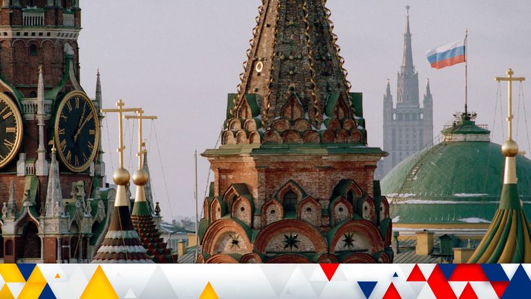 FILE - The Russian flag flies over the Kremlin between the spires of St. Basil's Cathedral in Moscow
PIC:AP