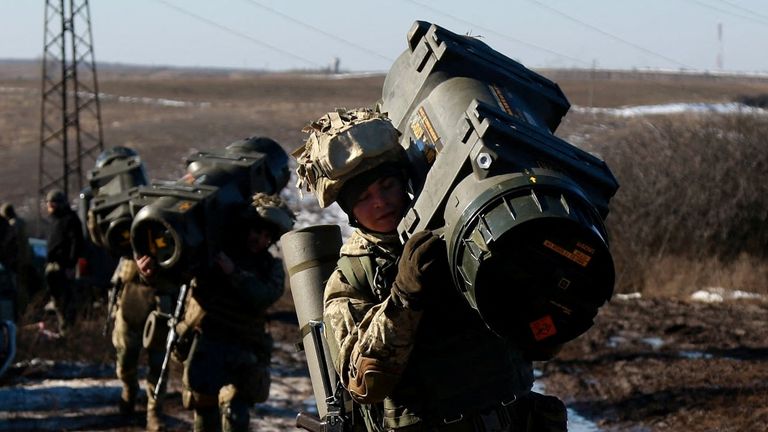 Service members of the Ukrainian Armed Forces carry weapons during military drills at a firing ground in the Donetsk region, Ukraine, February 15, 2022. Picture taken February 15, 2022. General Staff of the Ukrainian Armed Forces/Handout via REUTERS ATTENTION EDITORS - THIS IMAGE HAS BEEN SUPPLIED BY A THIRD PARTY.
