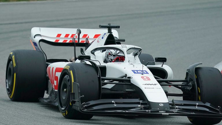 Russian driver Nikita Mazepin drives an all-white Haas F1 car in testing in Barcelona after the company dropped sponsor Uralkali