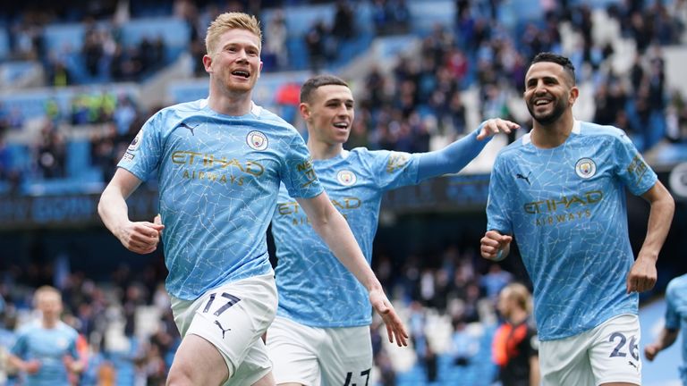 Soccer Football - Premier League - Manchester City v Everton - Etihad Stadium, Manchester, Britain - May 23, 2021 Manchester City's Kevin De Bruyne celebrates scoring their first goal with Riyad Mahrez and Phil Foden Pool via REUTERS/Dave Thompson 