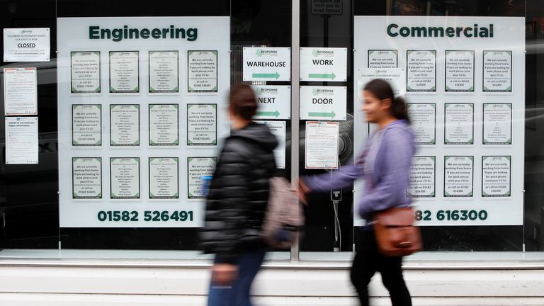 People walk past a recruitment shop, as the outbreak of the coronavirus disease (COVID-19) continues, in Luton, Britain August 6, 2020. REUTERS/Paul Childs