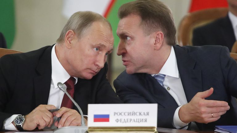 Russia's President Vladimir Putin (L) and First Deputy Prime Minister Igor Shuvalov speak during a session of the Council of Heads of the Commonwealth of Independent States (CIS) in Sochi, Russia October 11, 2017. REUTERS/Maxim Shemetov
