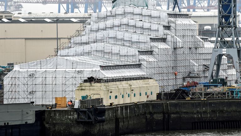 The 156 metres Dilbar superyacht owned by Russian billionaire Alisher Usmanov, lies in the Blohm & Voss dock in the harbor in Hamburg, Germany, March 3, 2022. REUTERS/Fabian Bimmer
