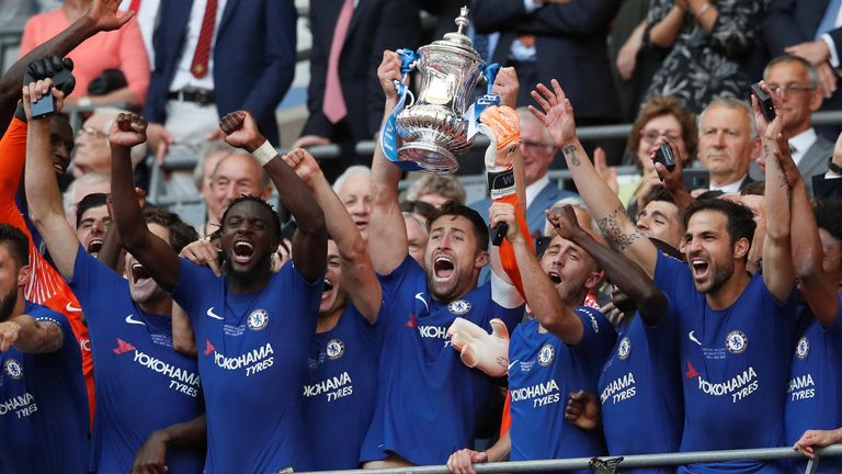 Soccer Football - FA Cup Final - Chelsea vs Manchester United - Wembley Stadium, London, Britain - May 19, 2018 Chelsea's Gary Cahill lifts the trophy as they celebrate winning the final REUTERS/David Klein
