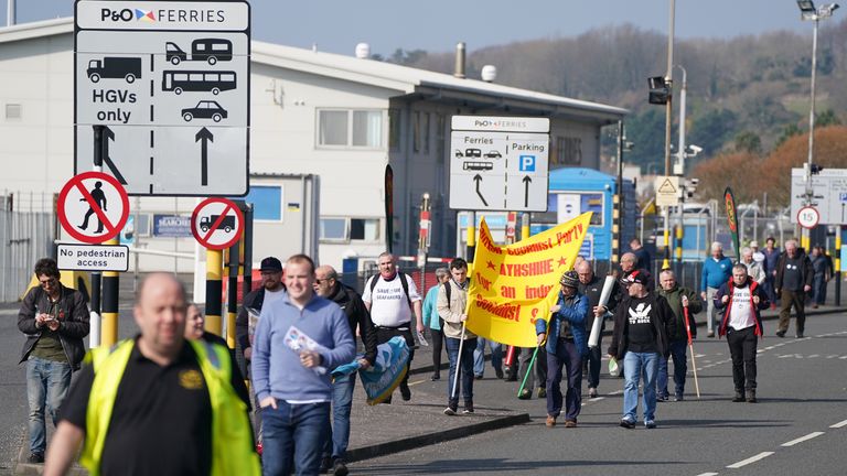 People take part in a demonstration against the dismissal of P&O workers organised by the Rail, Maritime and Transport (RMT) union at the P&O ferry terminal in Cairnryan, Dumfries and Galloway, after the ferry giant handed 800 seafarers immediate severance notices last week. Picture date: Wednesday March 23, 2022.