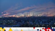 A general view shows a local oil refinery behind residential buildings in Omsk, Russia