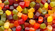 A mix of Midget Gems candy background, texture. sweet food.