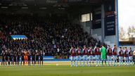 A minute's silence was held before kick-off at Turf Moor but some Chelsea fans chanted for outgoing Russian club owner Roman Abramovich