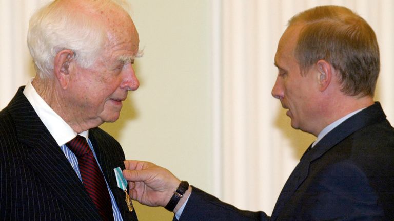 Russian President Vladimir Putin (R) hands over an Order of Friendship to PepsiCo founder Donald M. Kendall in the Moscow's Kremlin, June 21, 2004