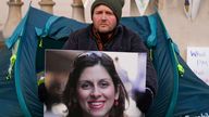 Richard Ratcliffe, the husband of detained charity worker Nazanin Zaghari-Ratcliffe, continues with his hunger strike outside the Foreign, Commonwealth and Development Office in London, Tuesday Nov. 9, 2021. Ratcliffe began his hunger strike after a court decided his wife has to spend another year in an Iranian prison, she has already been detained for more than five years in Iran. (AP Photo/Frank Augstein)