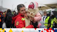 An employee from the Emergency Situations Department holds the baby of a refugee fleeing the conflict from neighbouring Ukraine at the Romanian-Ukrainian border, in Siret, Romania, Thursday, March 10, 2022. (AP Photo/Andreea Alexandru)
PIC:AP