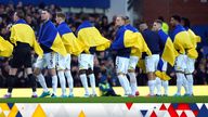 Everton players with the Ukraine flag before the Premier League match at Goodison Park, Liverpool. Picture date: Saturday February 26, 2022.