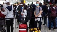 Passengers queue for airport check-in ahead of the Easter Bank Holiday weekend, at Heathrow Airport, in London, Britain, April 14, 2022. REUTERS/Hannah McKay
