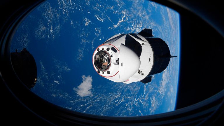 In this April 24, 2021 file photo made available by NASA, the SpaceX Crew Dragon capsule approaches the International Space Station for docking.