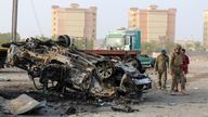 Soldiers inspect the wreckage of a vehicle at the scene of a car bomb attack that killed a senior Yemeni military leader, Brigadier General Thabet Gawas, in the southern port city of Aden, Yemen March 24, 2022. REUTERS/Fawaz Salman
