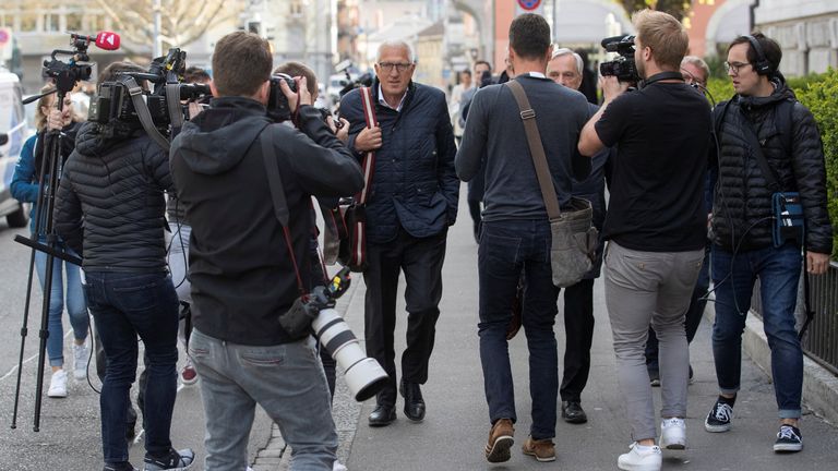 Pierin Vincenz, former CEO of Swiss Raiffeisen bank and his lawyer Lorenz Erni are surrounded by media as they leave after a trial in Zurich, Switzerland April 13, 2022. REUTERS/Arnd Wiegmann
