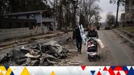 A family walks past a car crushed by a Russian tank in Bucha, in the outskirts of Kyiv, Ukraine, Tuesday, April 5, 2022. Ukraine's president planned to address the U.N.'s most powerful body on Tuesday after even more grisly evidence emerged of civilian massacres in areas that Russian forces recently withdrew from. (AP Photo/Rodrigo Abd)
PIC:AP