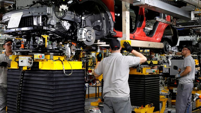 Workers are seen on the production line at Nissan's car plant in Sunderland, Britain, October 10, 2019.