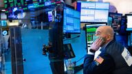 In this photo provided by the New York Stock Exchange, trader Fred DeMarco works on the trading floor, Wednesday, Jan. 26, 2022. An early market rally on Wall Street gave way to a broad slide for stocks and a surge in bond yields Wednesday after the Federal Reserve signaled it plans to begin raising interest rates ...soon... to fight a spike in inflation that the central bank says is probably getting worse.  (Allie Joseph/New York Stock Exchange via AP)