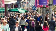 ESPLS..Crowds of people passing shops and businesses on Buchanan Street, one of Glasgow's busiest shopping streets.