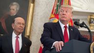 US President Donald Trump speaks alongside Secretary of Commerce Wilbur Ross 