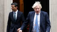 British Prime Minister Boris Johnson and Chancellor of the Exchequer Rishi Sunak walk out of Downing Street to meet Michelle Ovens of Small Business Saturday, in London, Britain, December 1, 2021. REUTERS/Henry Nicholls
