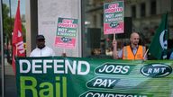 Workers and members of the RMT (The National Union of Rail, Maritime and Transport Workers) union stand on a picket across the street from Victoria railway station in London, Tuesday, June 21, 2022. Tens of thousands of railway workers walked off the job in Britain on Tuesday, bringing the train network to a crawl in the country...s biggest transit strike for three decades. (AP Photo/Matt Dunham)