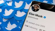 FILE PHOTO: Elon Musk's Twitter profile is seen on a smartphone placed on printed Twitter logos in this picture illustration taken April 28, 2022. REUTERS/Dado Ruvic/Illustration/File Photo
